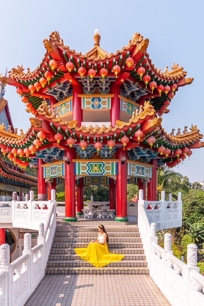 A girl in yellow skirt sitting in thean hou temple in kuala lumpur malaysia