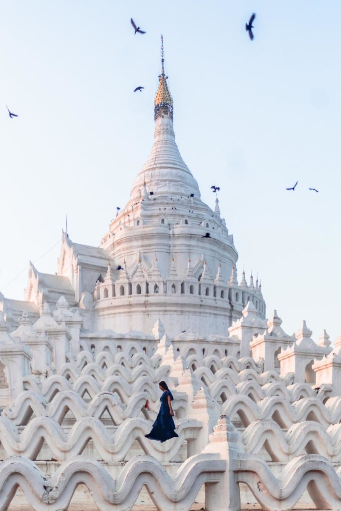 A girl in blue dress standing on the wave structure at Hsinbyume pagoda