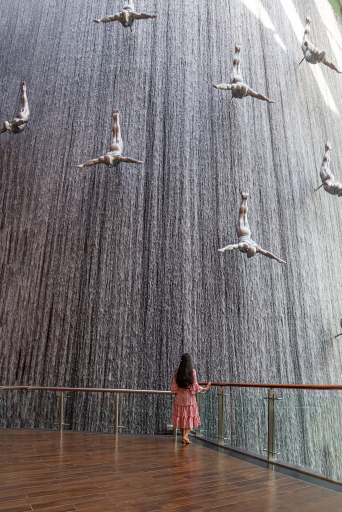 The waterfall wall with diving sculpture inside the Dubai mall