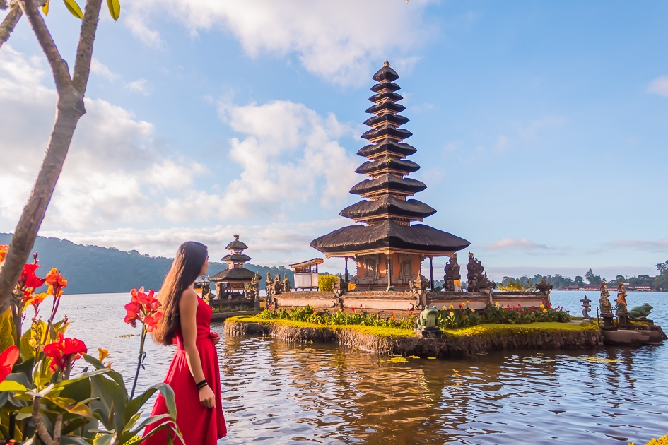 A girl in awe of the stunning Pura Ulun danu Beratan Temple in bali