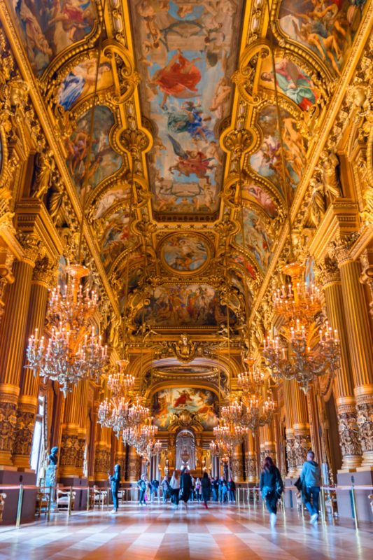 The golden details on the ceiling in Grand foyer room at Palais Garnier